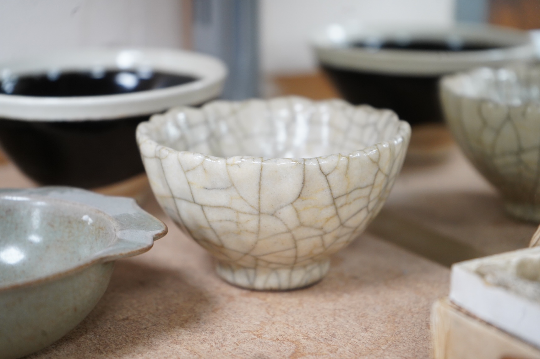 A collection of Chinese porcelain and pottery to include a naturalistic teapot, crackle glaze bowl and a ‘dragon’ bowl, largest 10cm in diameter
